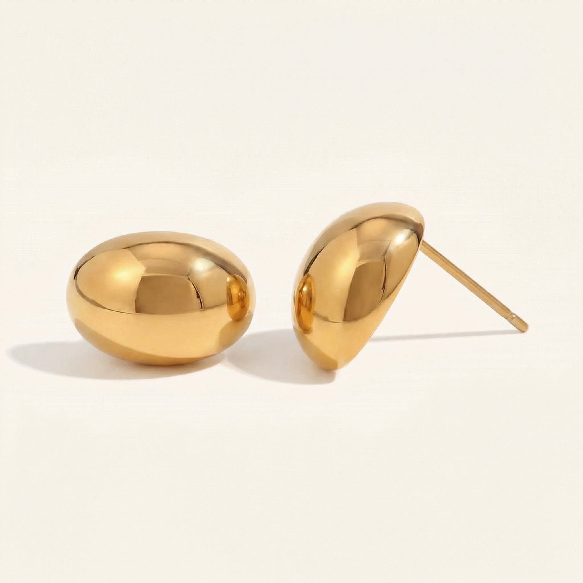 Gold-plated bean stud earrings from side angle