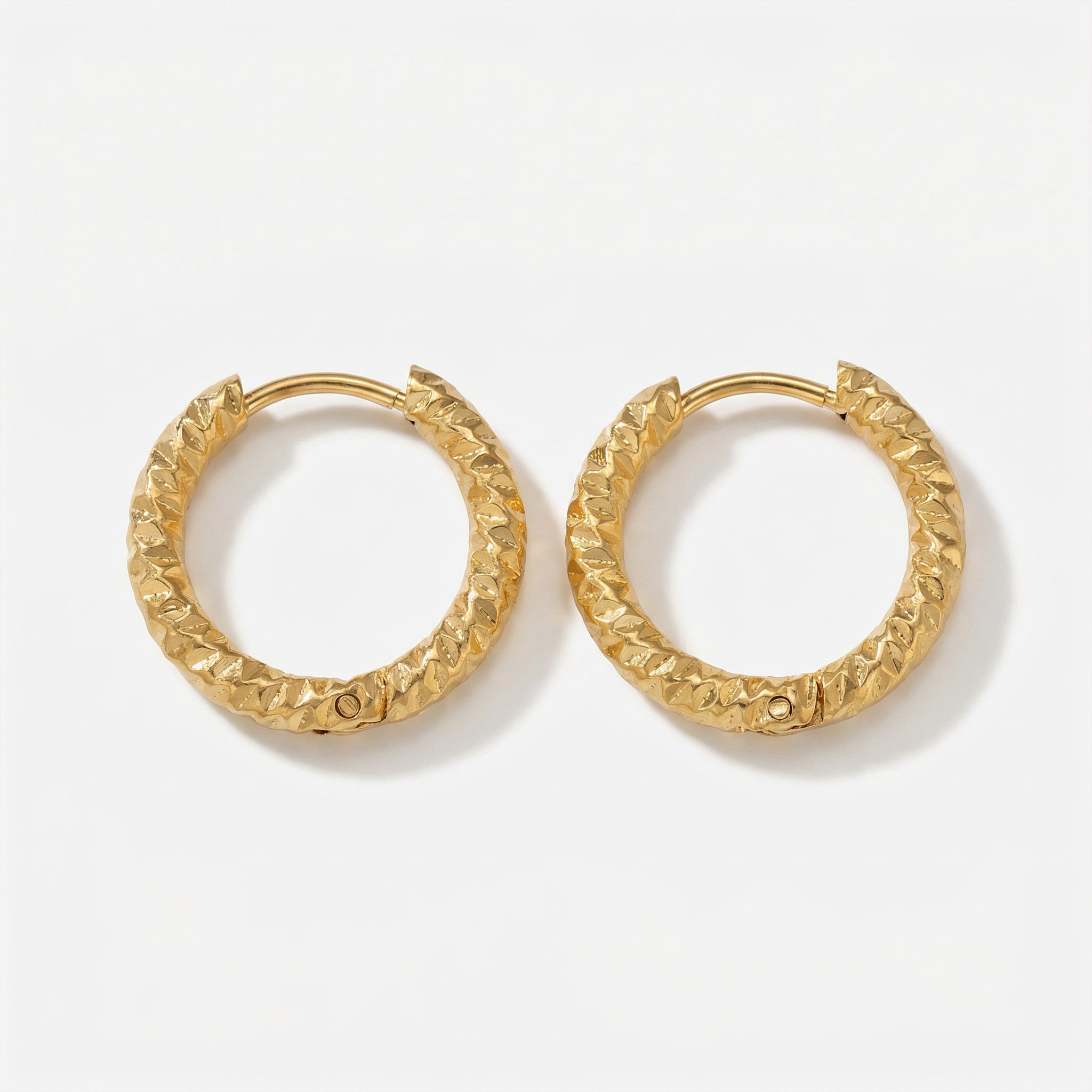 Gold-plated top-down view of hammered gold hoops