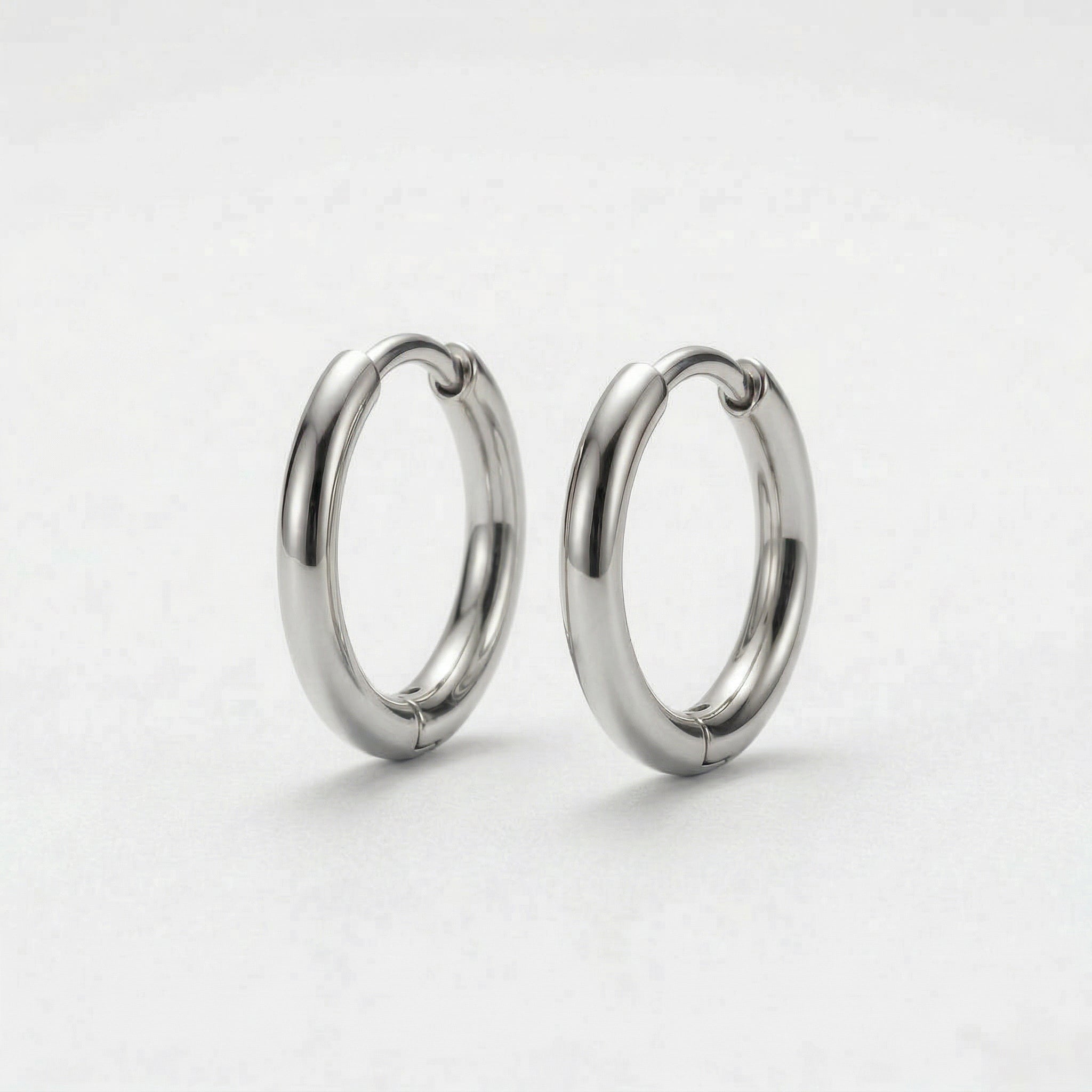 Silver hoop earrings on white