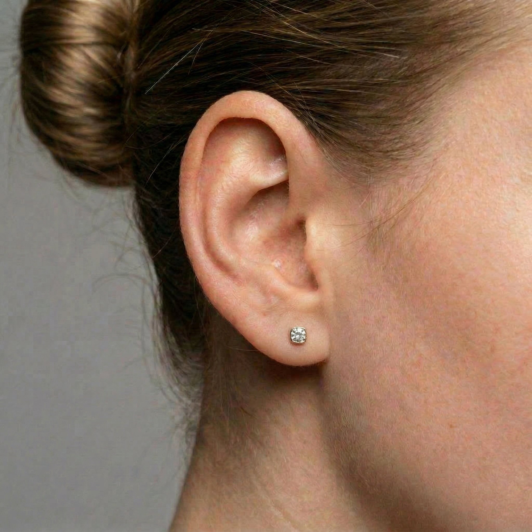 Crystal stud earrings gold-plated earring worn on a woman's ear