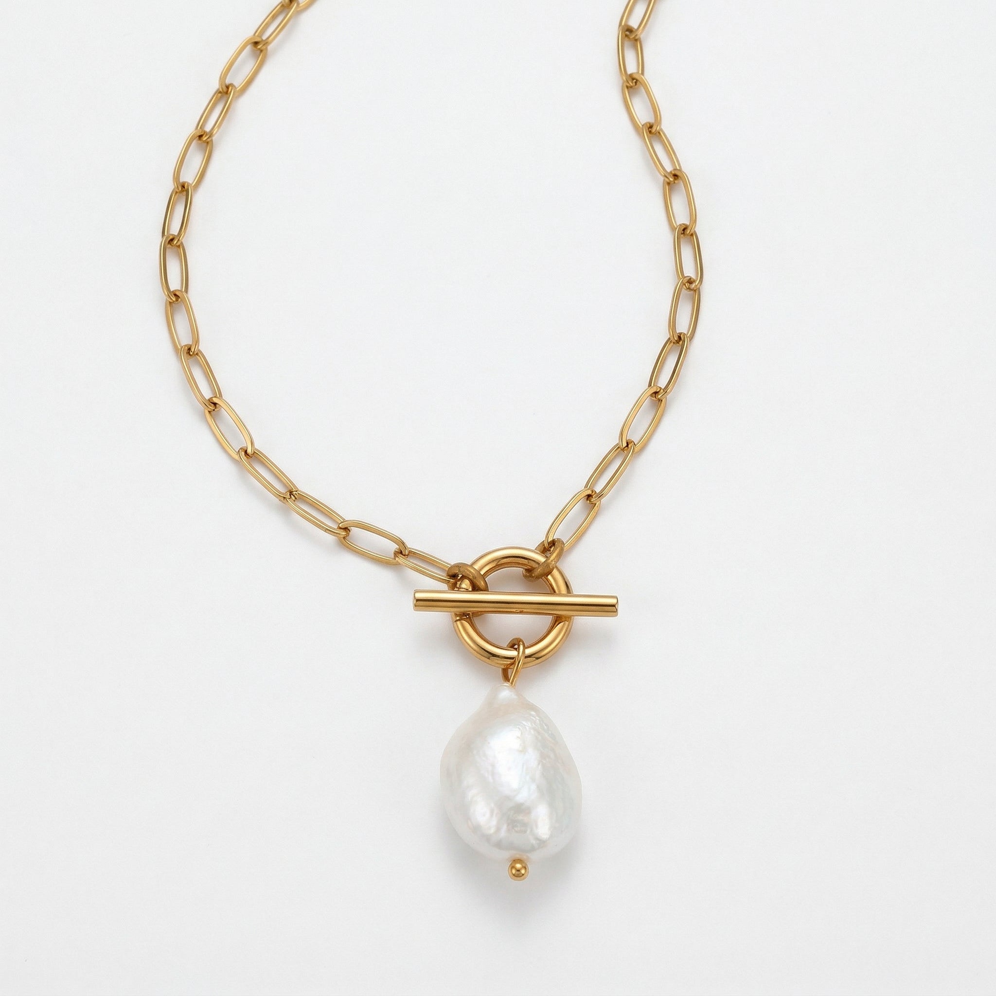 Gold-plated top-down view of necklace with pearl