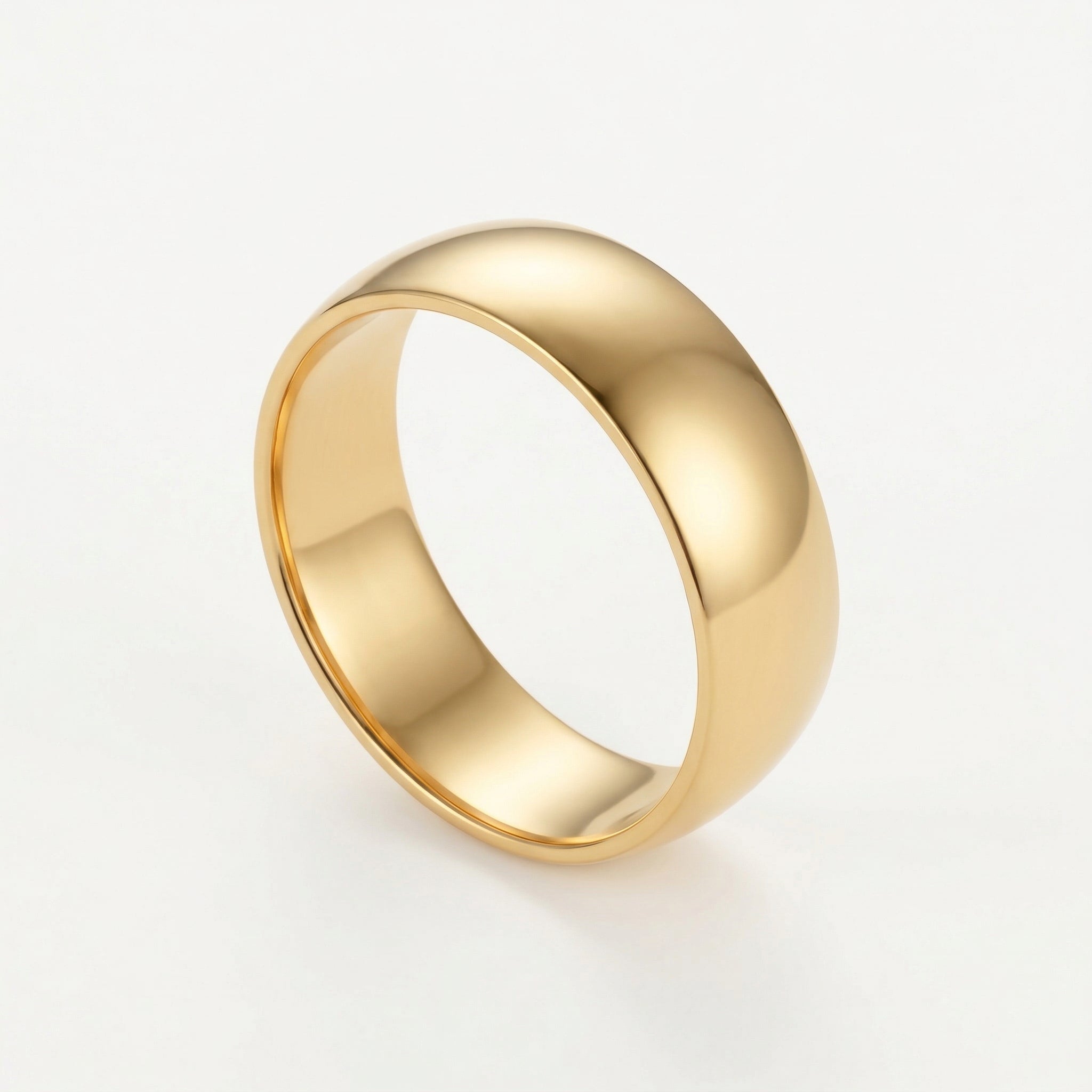 Gold-plated polished gold ring on white background