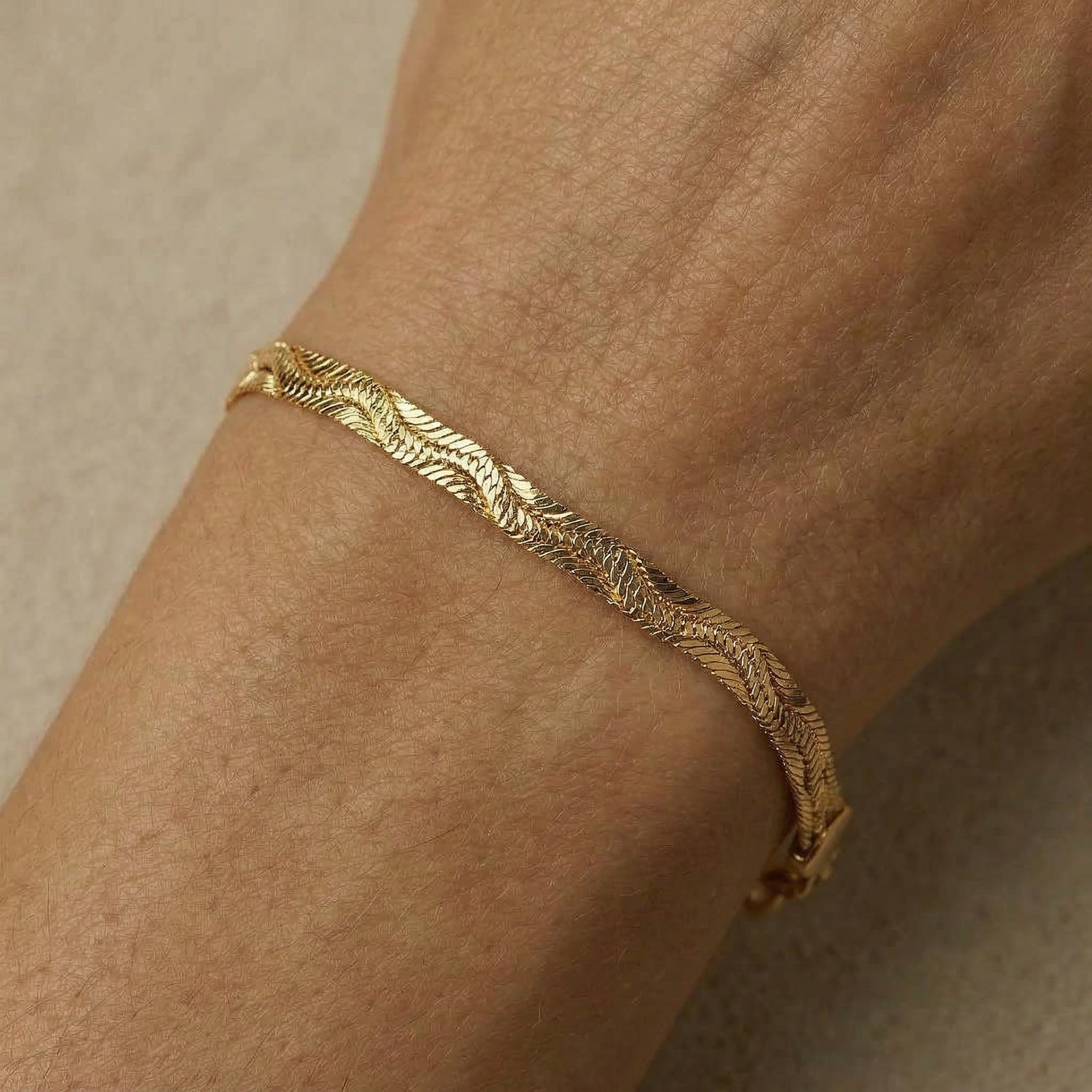 Gold-plated close up of bracelet on wrist