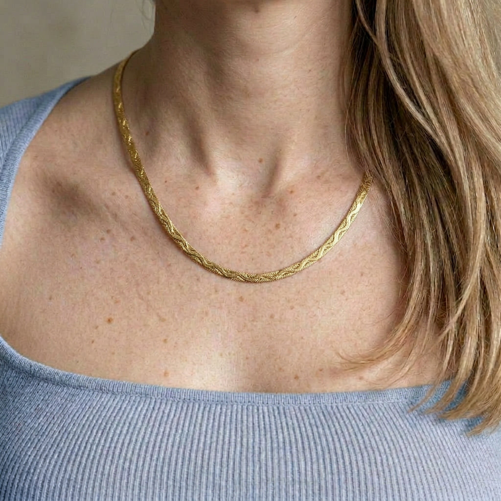 Gold-plated necklace worn with blue top