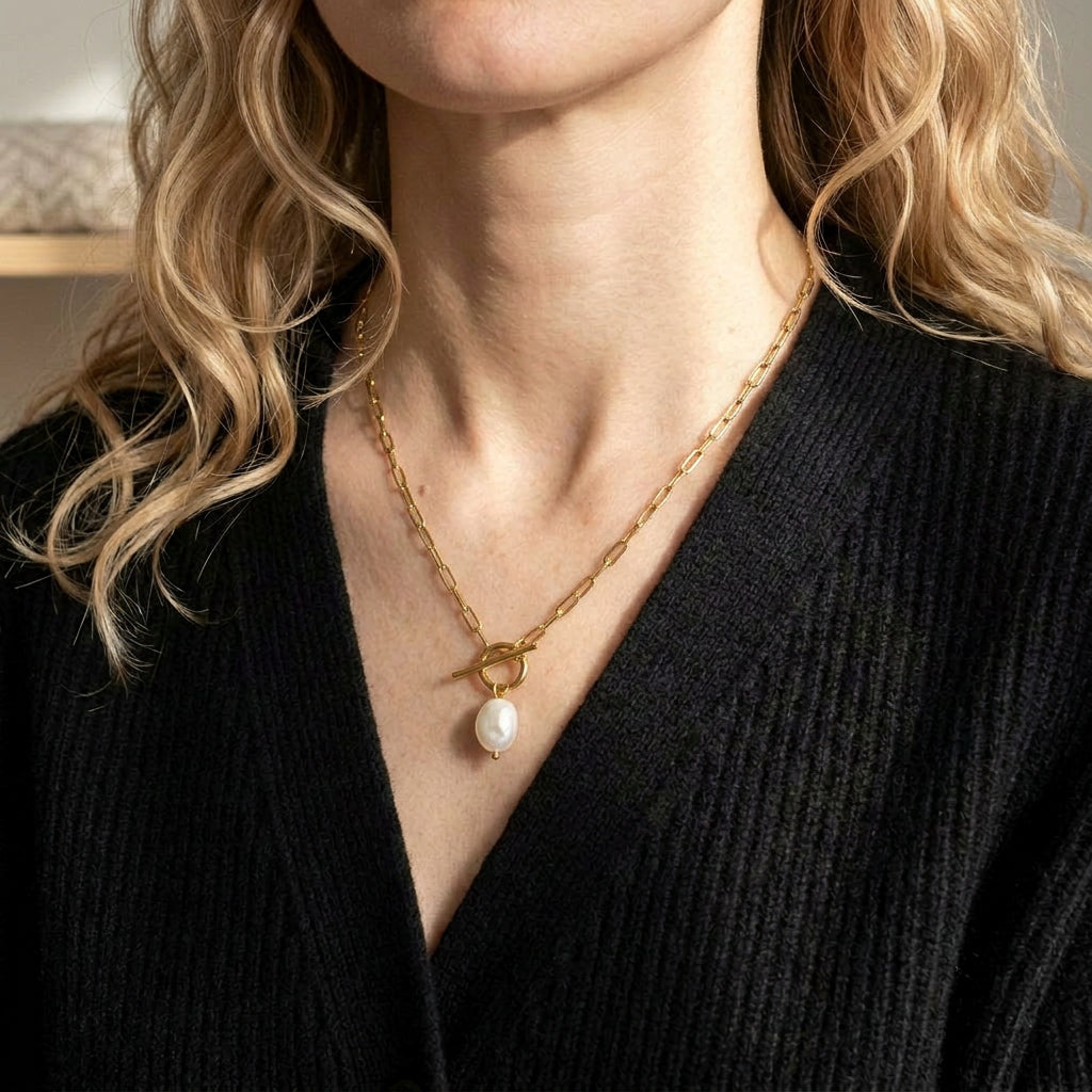 Gold-plated necklace worn on model with black top