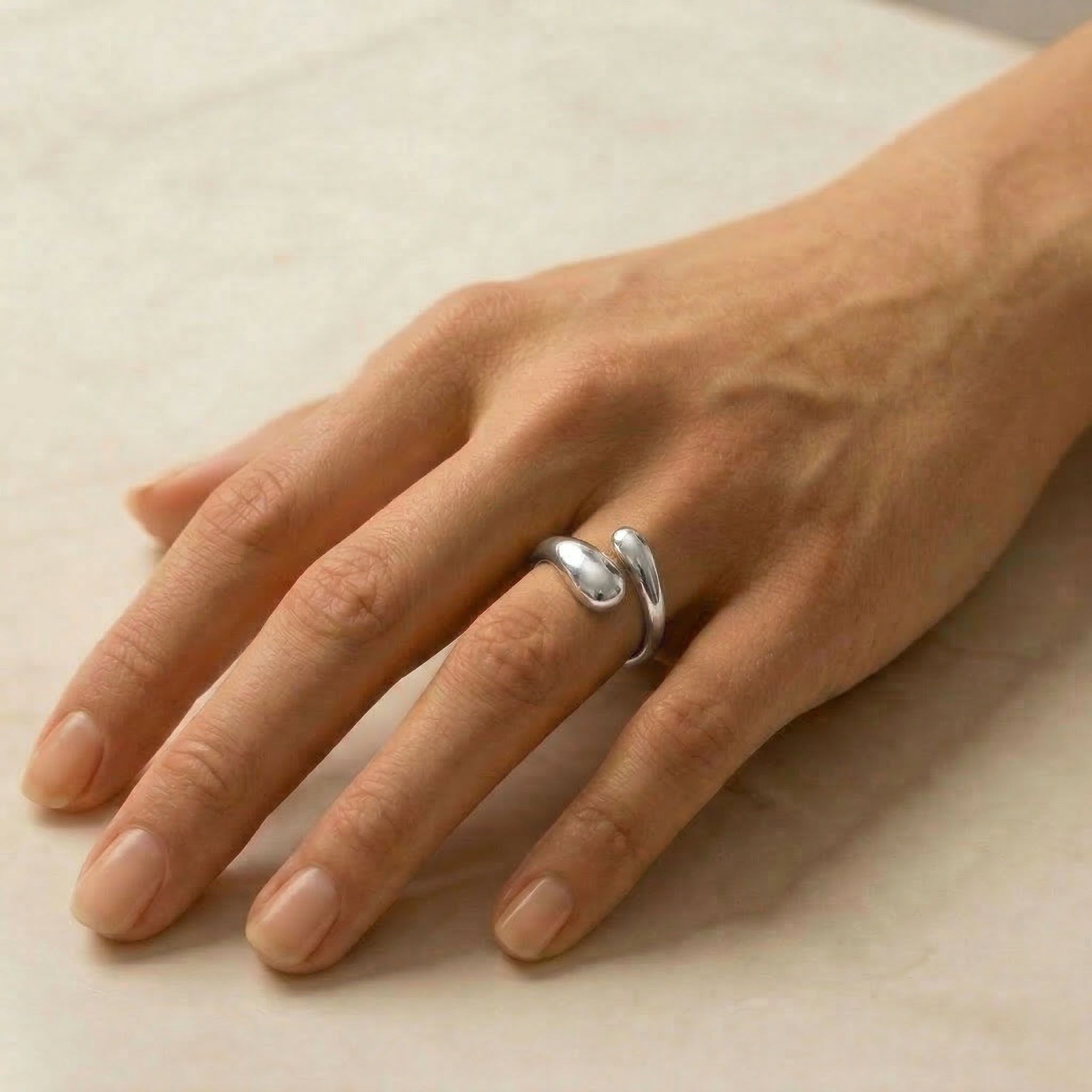 Silver ring worn on hand