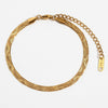 Gold-plated snake chain bracelet with an adjustable extender chain and an 18K tag.