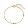 Gold-plated bracelet with flat, round, textured links, a lobster clasp, and an extender chain with a "PRSML" tag.