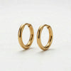 Pair of small, shiny gold hoop earrings on a white background.