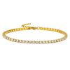 Gold tennis bracelet with square-cut clear gemstones and an adjustable chain on a white background.