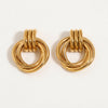 Pair of gold-plated earrings with three intertwined rings hanging from a triple-band stud.