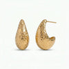Pair of hammered gold-plated teardrop hoop earrings with post backs.