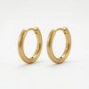 Pair of matte gold hoop earrings with "925" engraving on the inside.