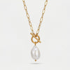 Gold chain necklace with a toggle clasp and a large, irregular white baroque pearl pendant.
