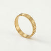 Gold ring with a textured band of overlapping, scale-like shapes.