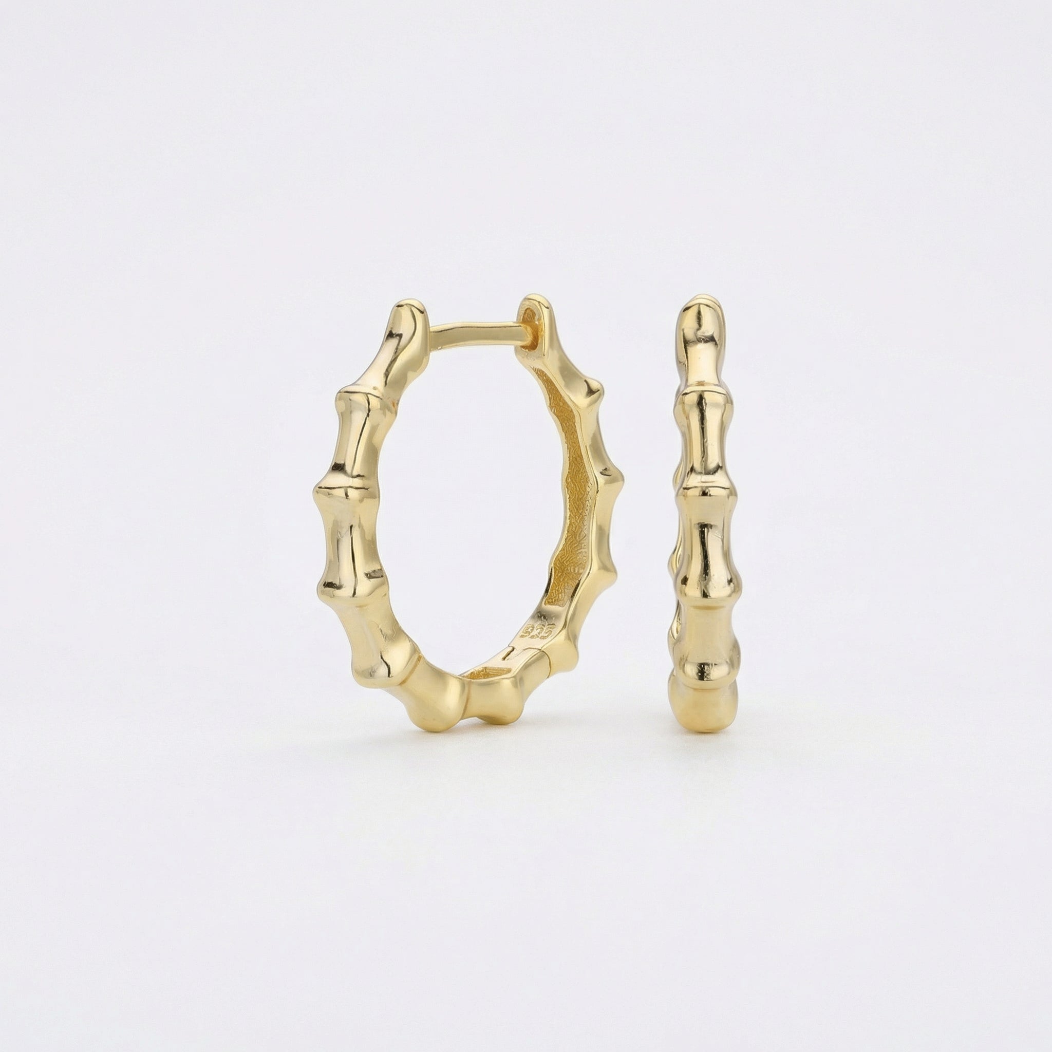 Gold-plated single gold bamboo hoop earring standing upright