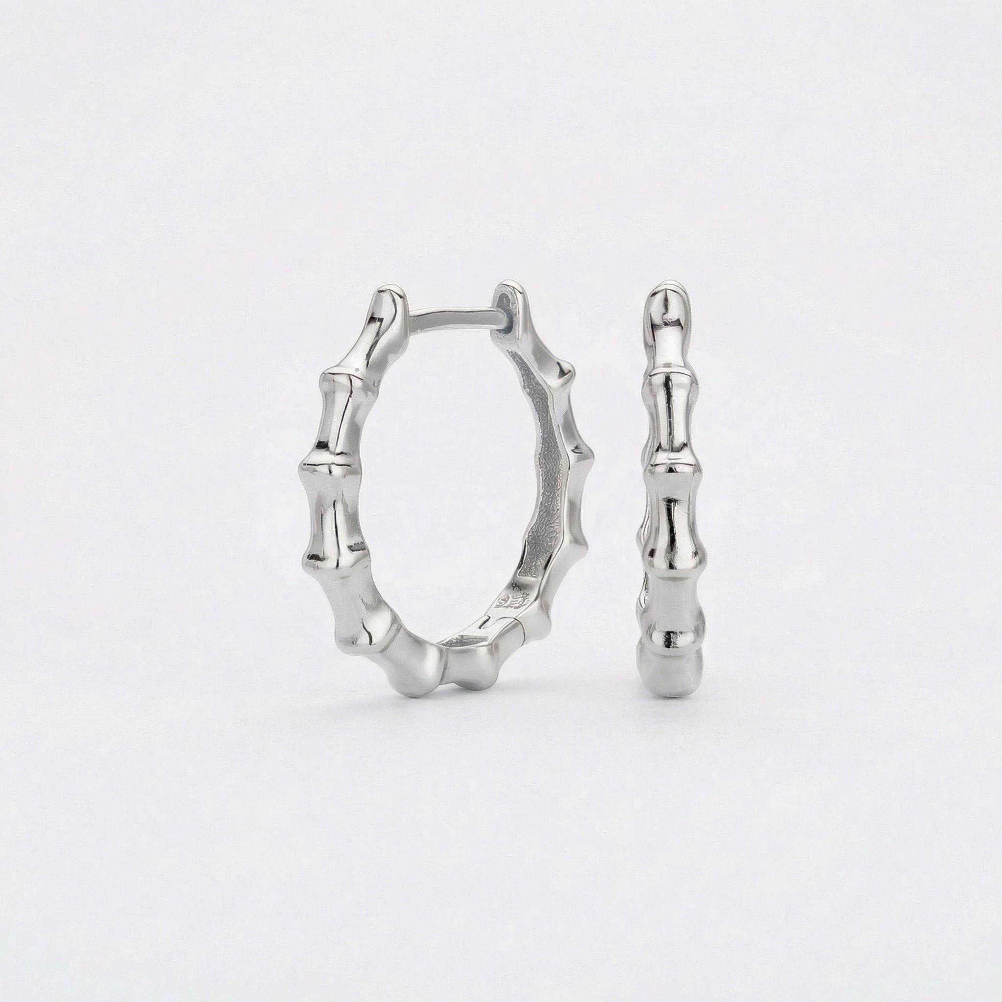 Silver bamboo hoop earrings on white