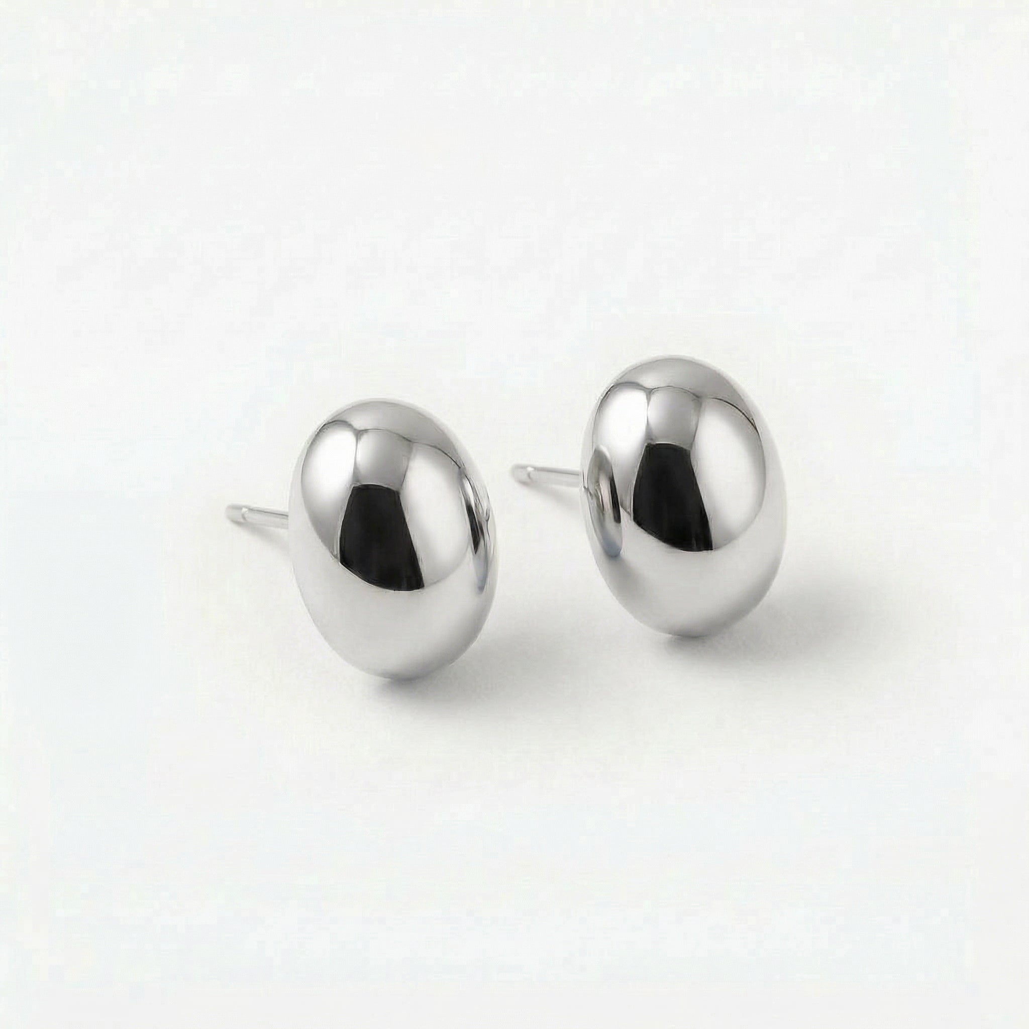 Silver bean stud earrings from angle