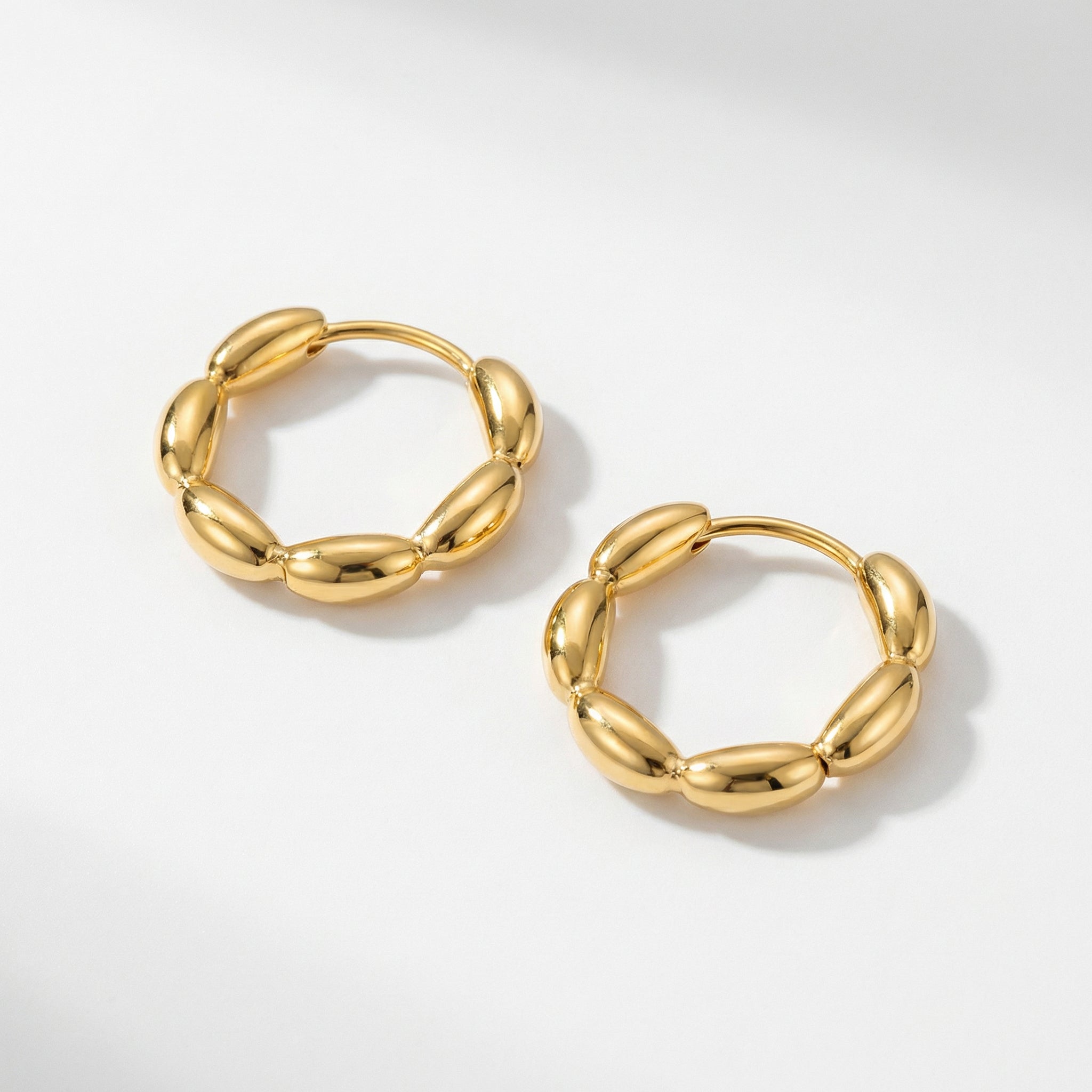 Gold-plated top-down view of gold huggie hoops