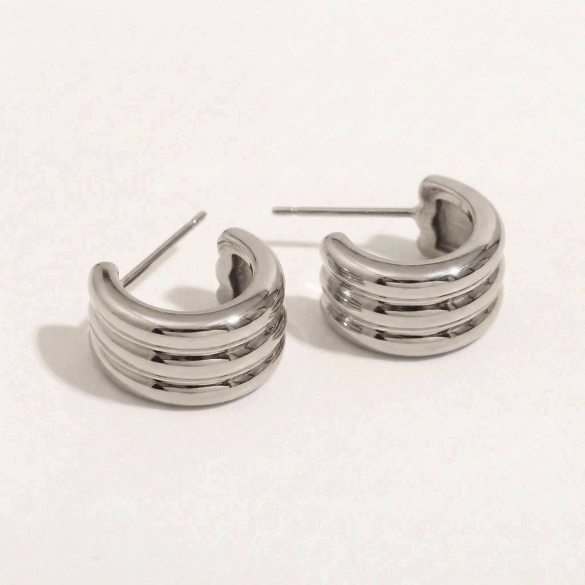 Top-down view of silver hoop earrings