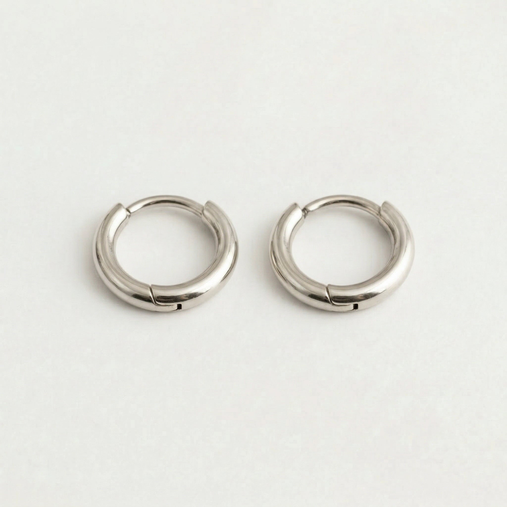 Clasp mechanism on silver hoop earrings