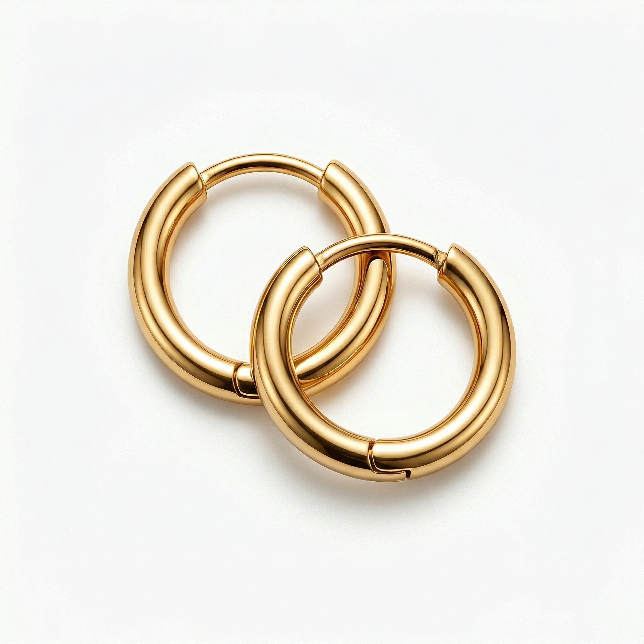 Gold-plated hoops intertwined, slightly angled view