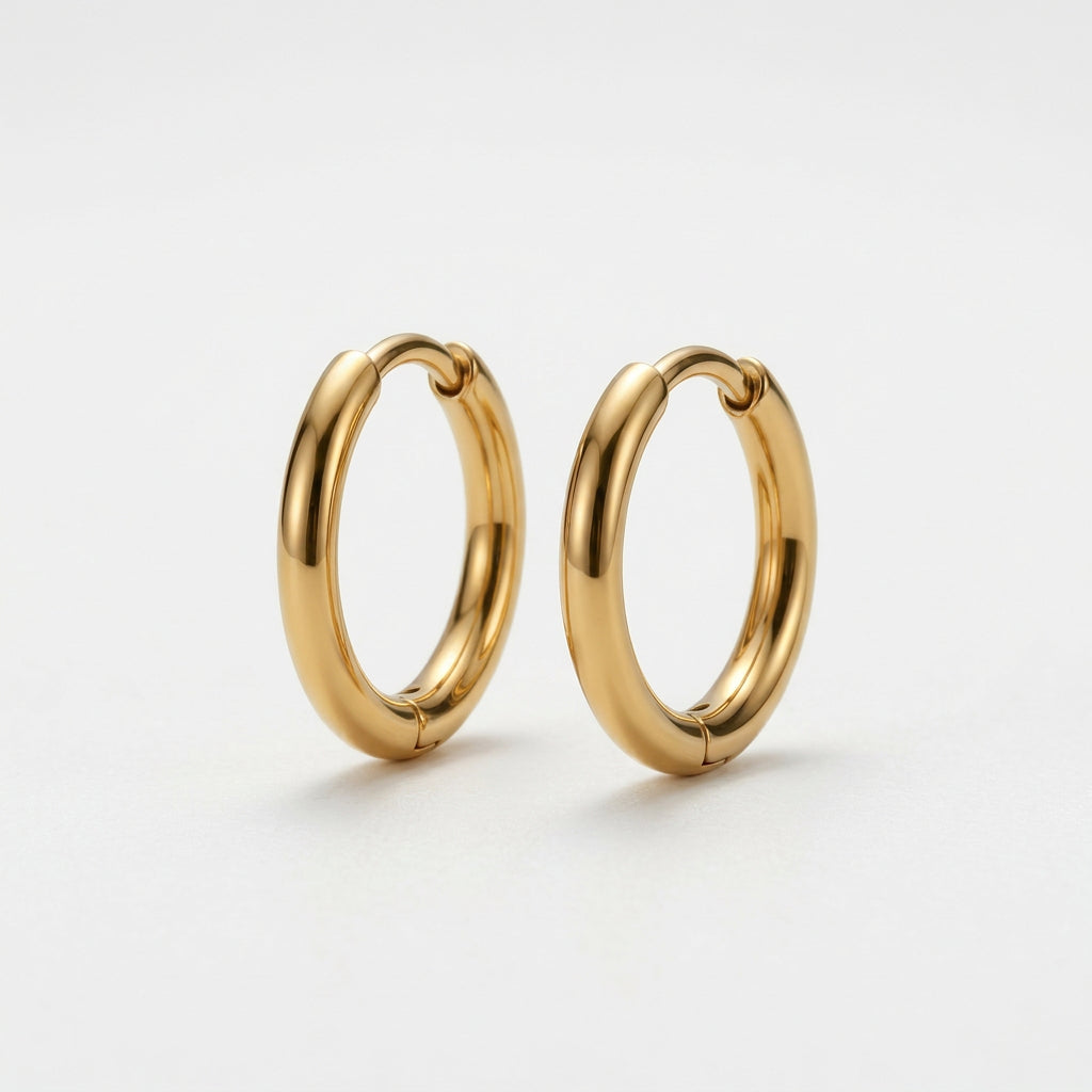 Gold-plated hoop earrings standing upright