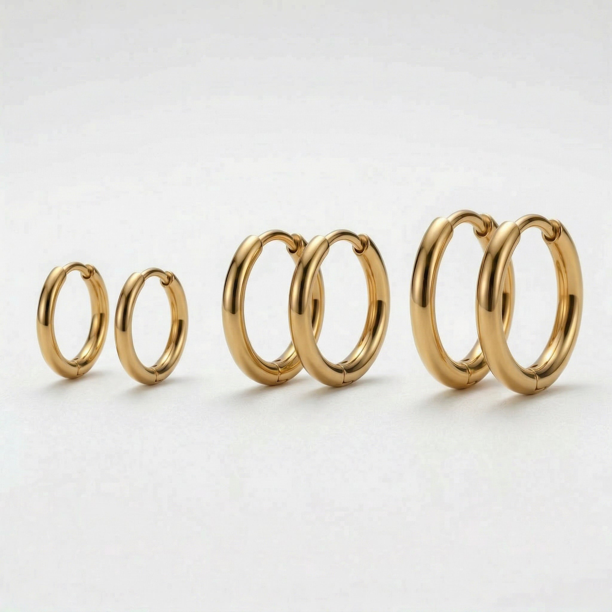 Gold-plated three pairs of gold hoops, varying sizes