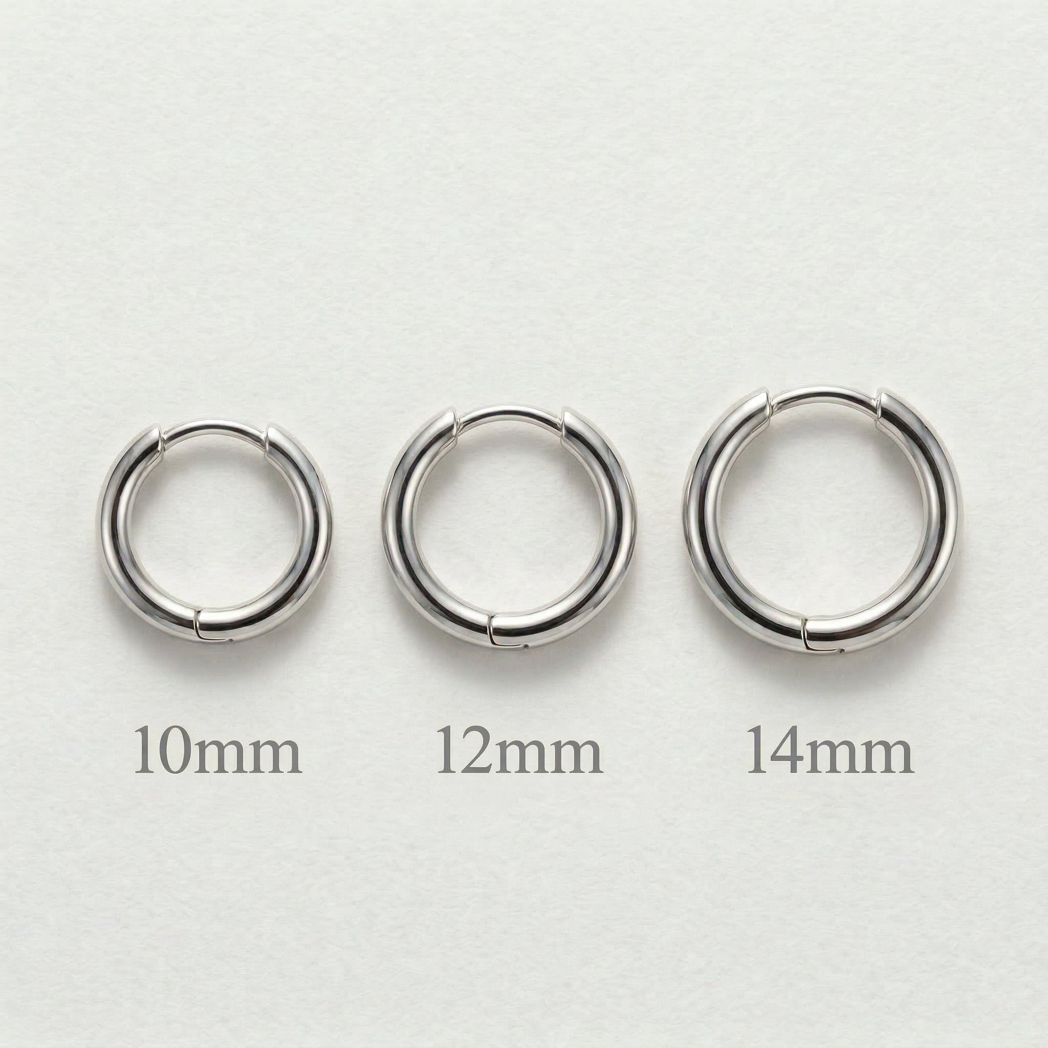 Three silver hoops with size labels