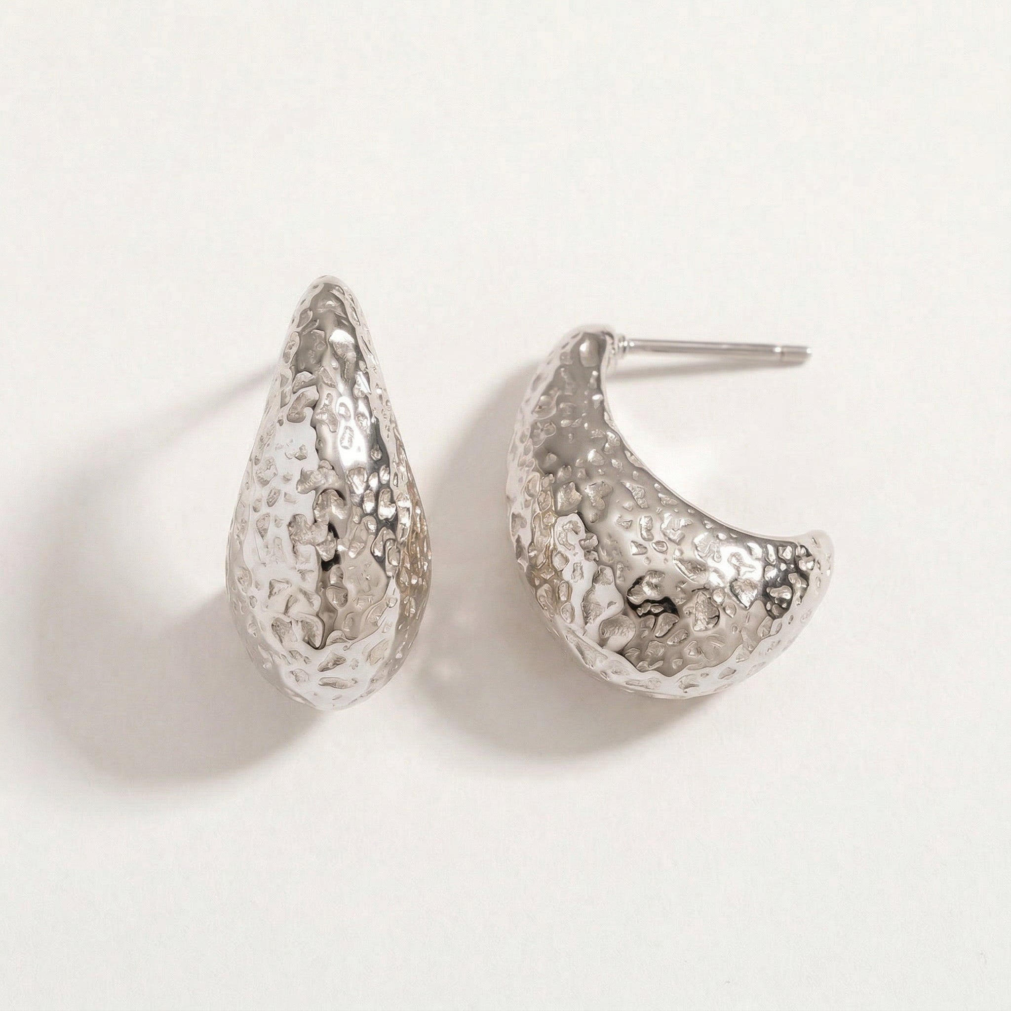 Silver top-down view of hammered hoop earrings