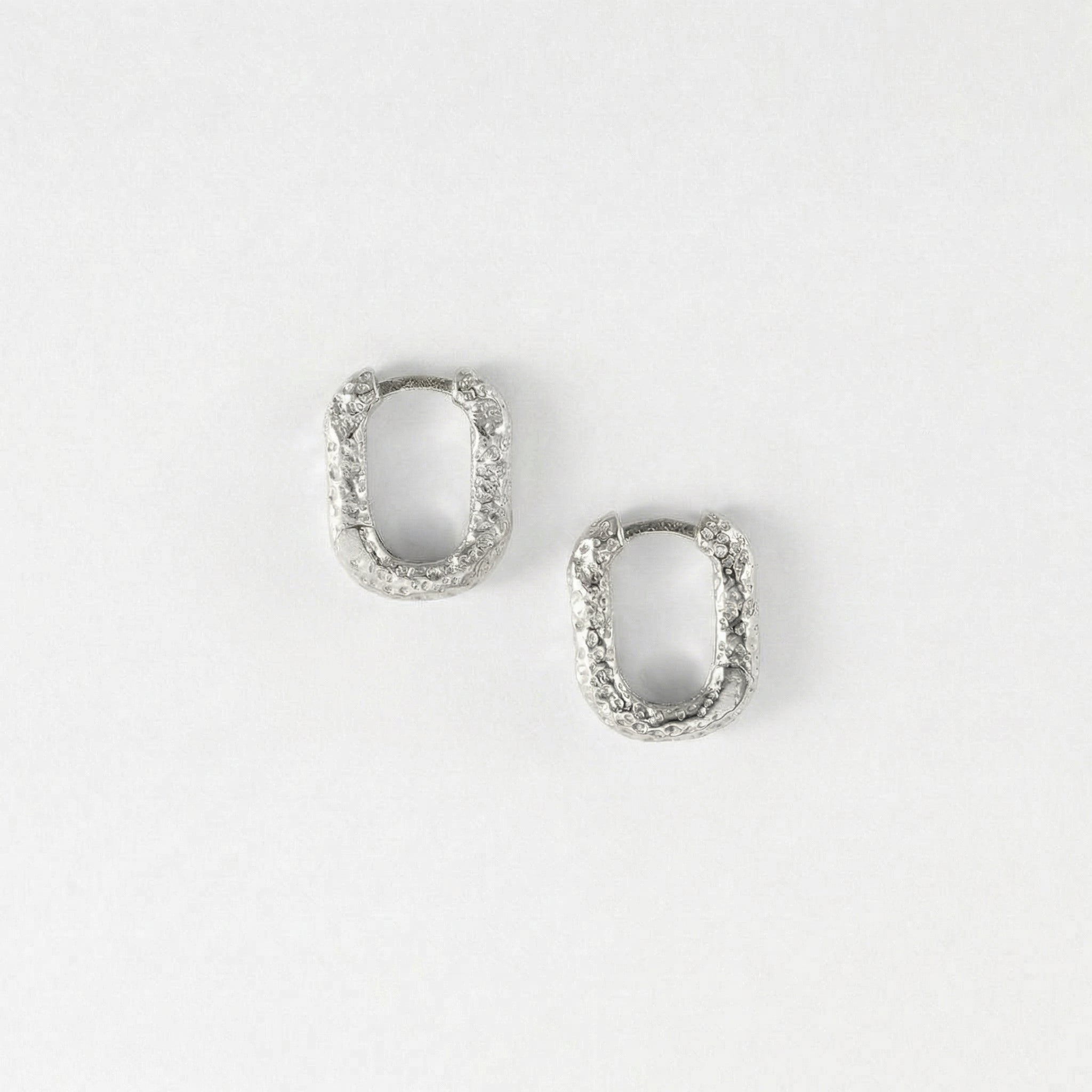 Top-down view of silver hoop earrings