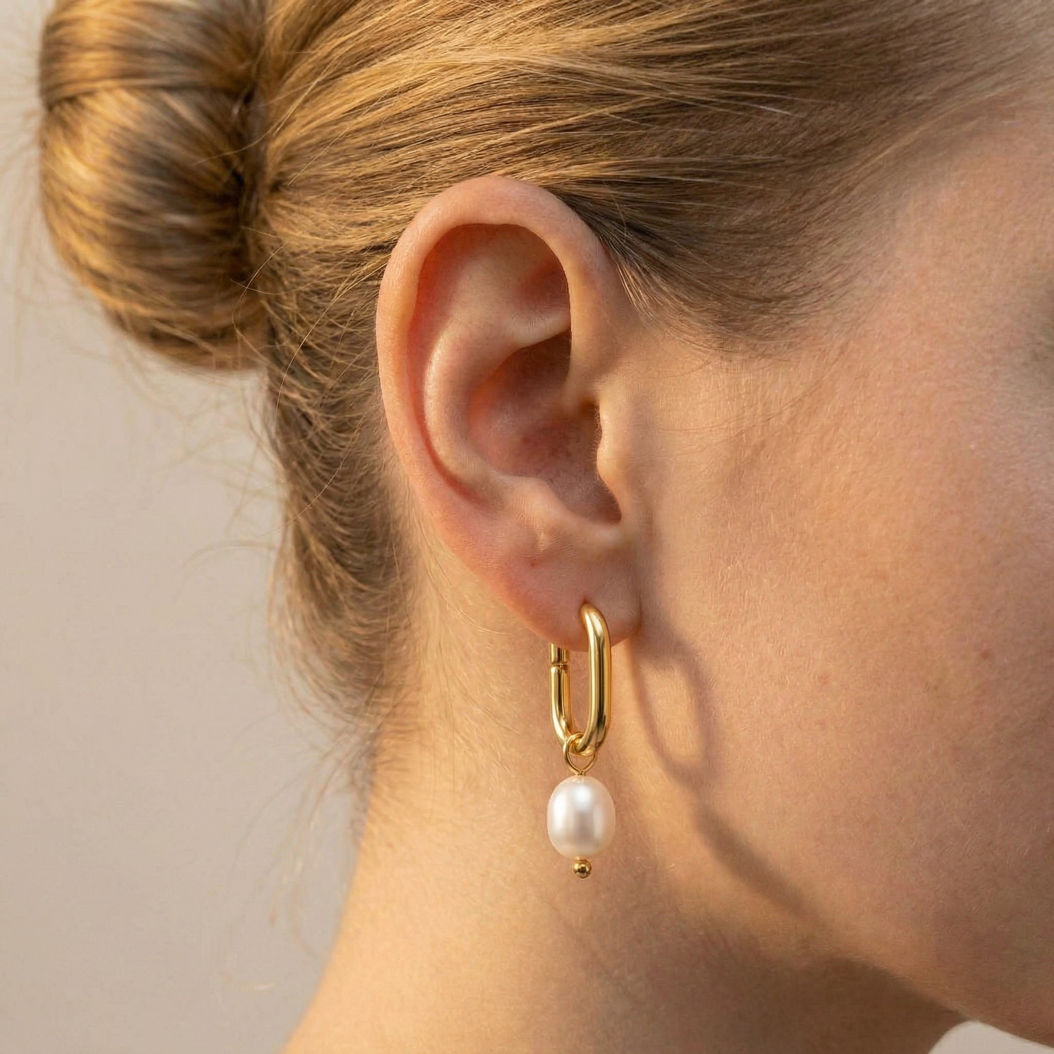 Pearl hoop earrings gold-plated earring worn on model with hair up