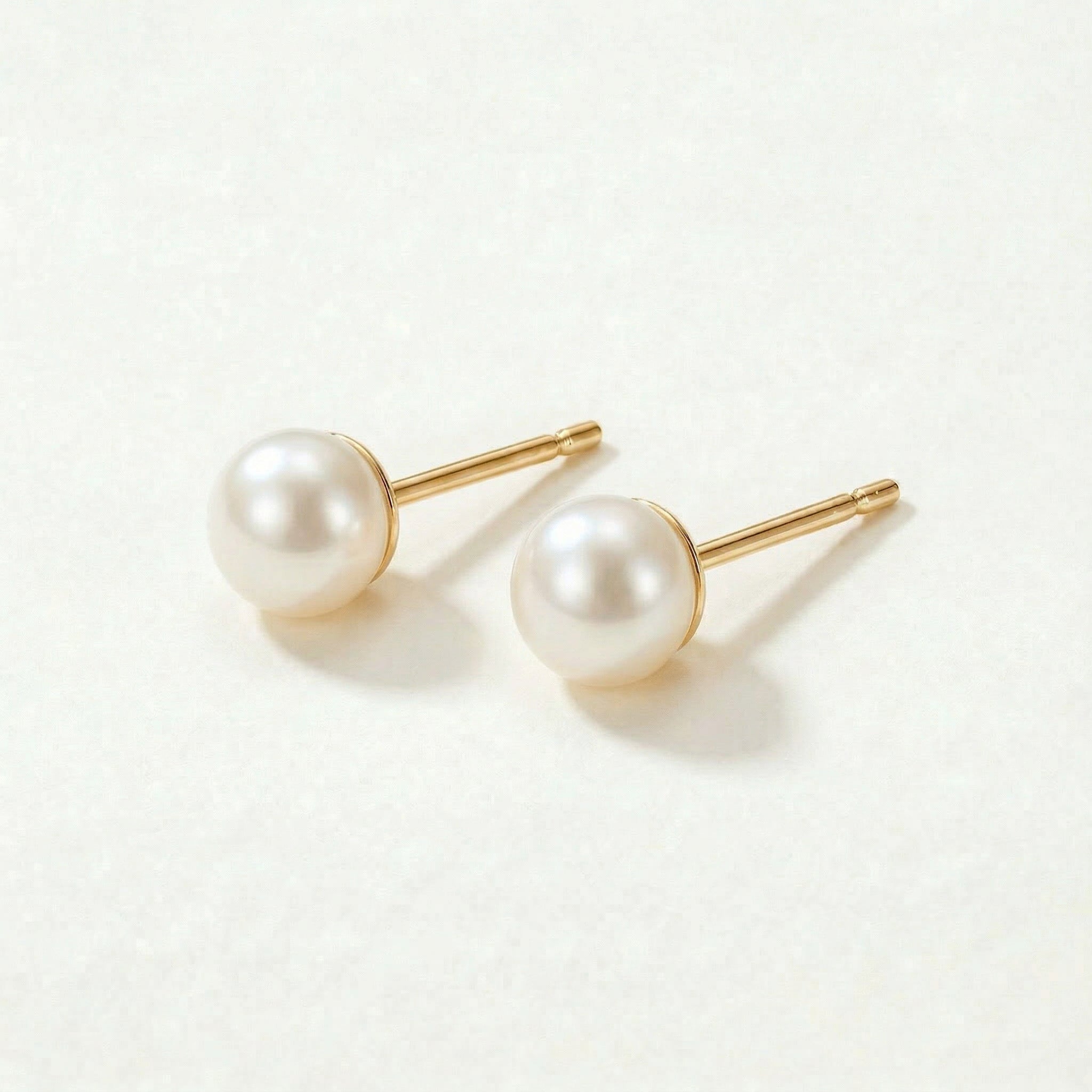 Gold-plated pearl studs from a different angle
