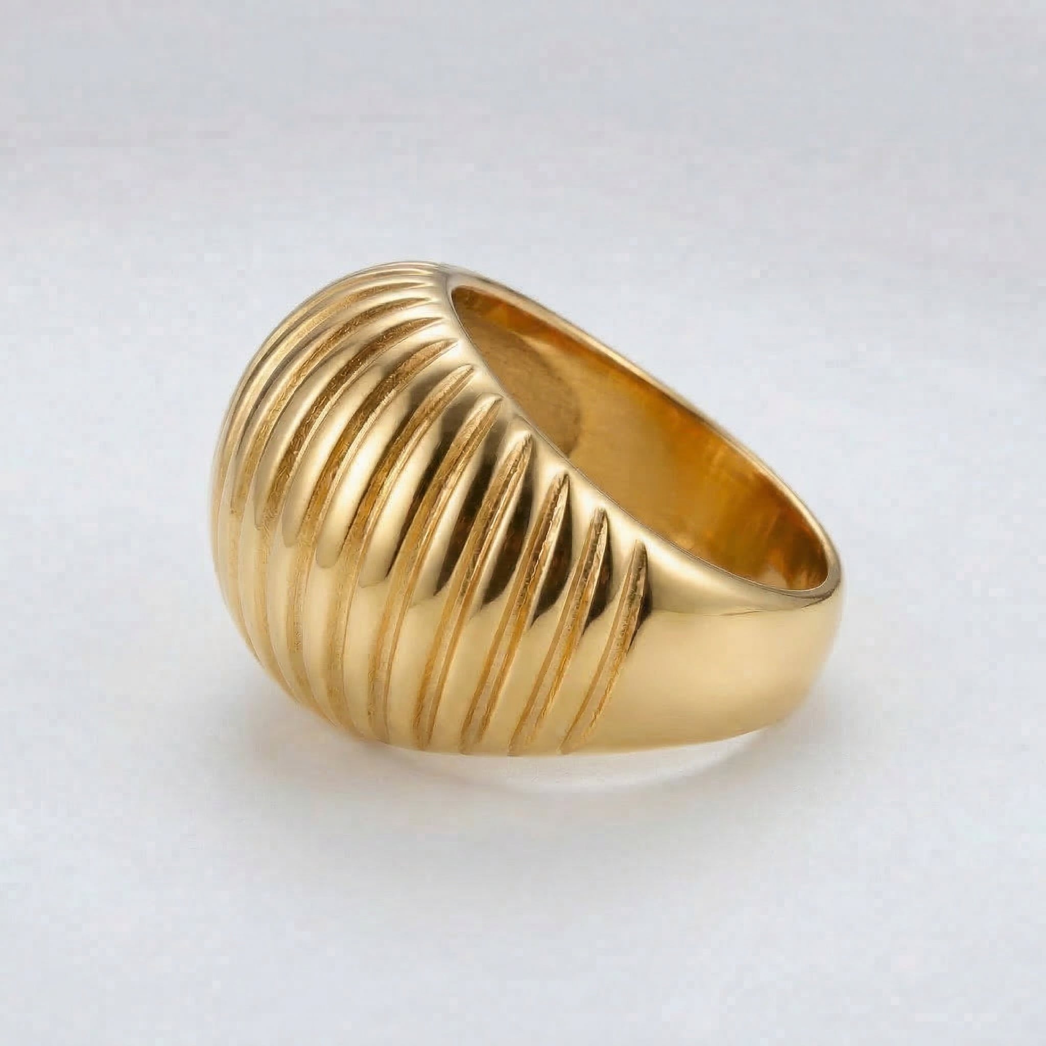Gold-plated side view of ribbed dome ring