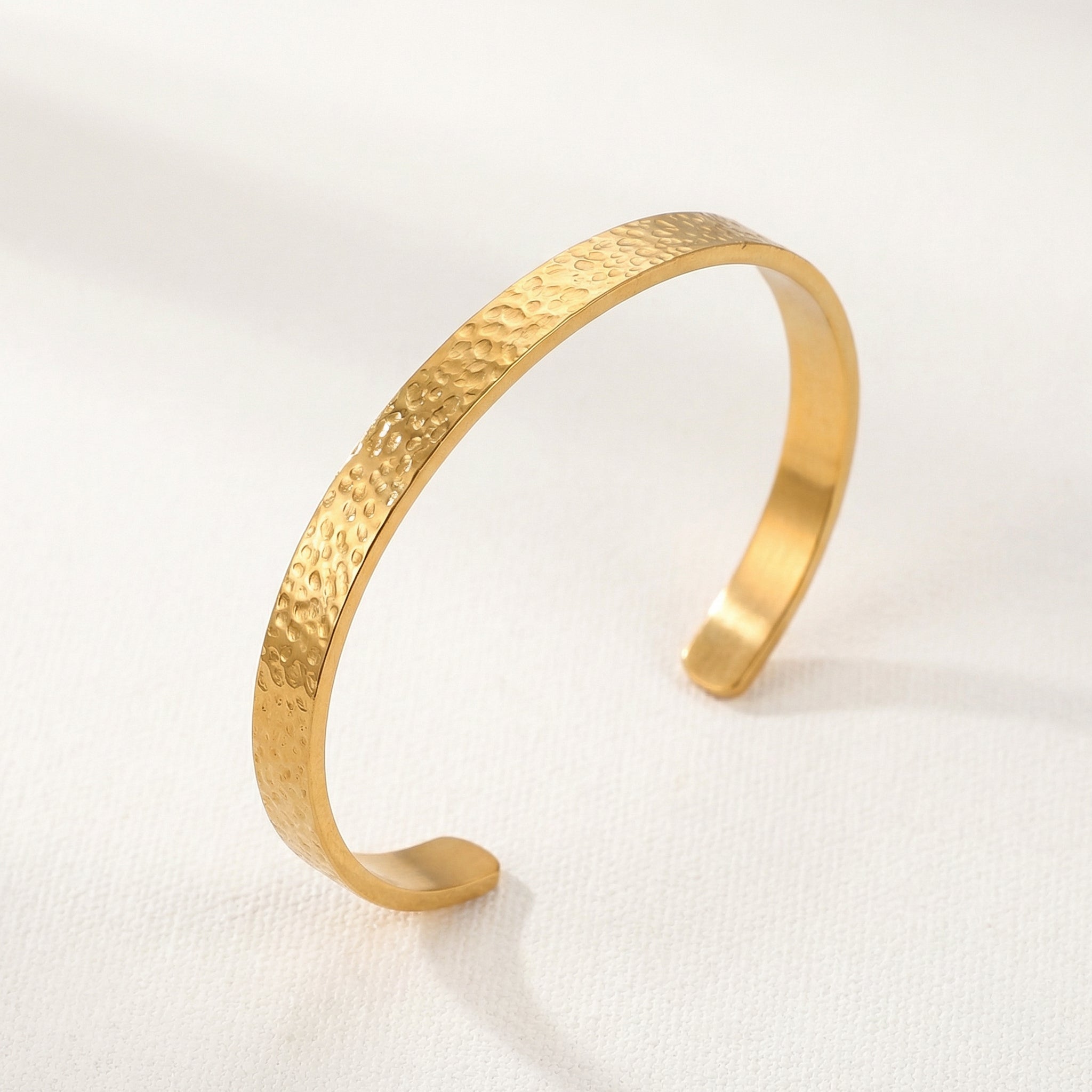 Gold-plated hammered bangle, side view