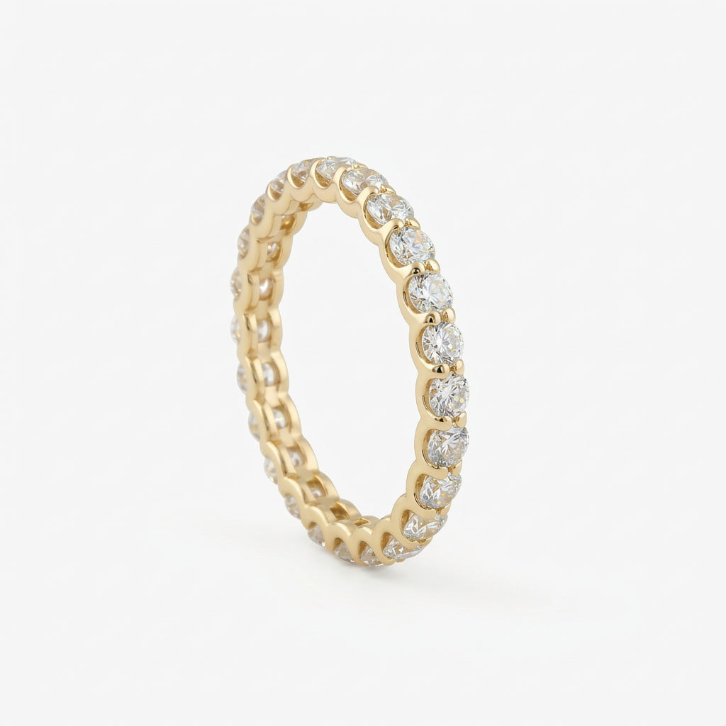 Gold-plated eternity ring with crystals on white