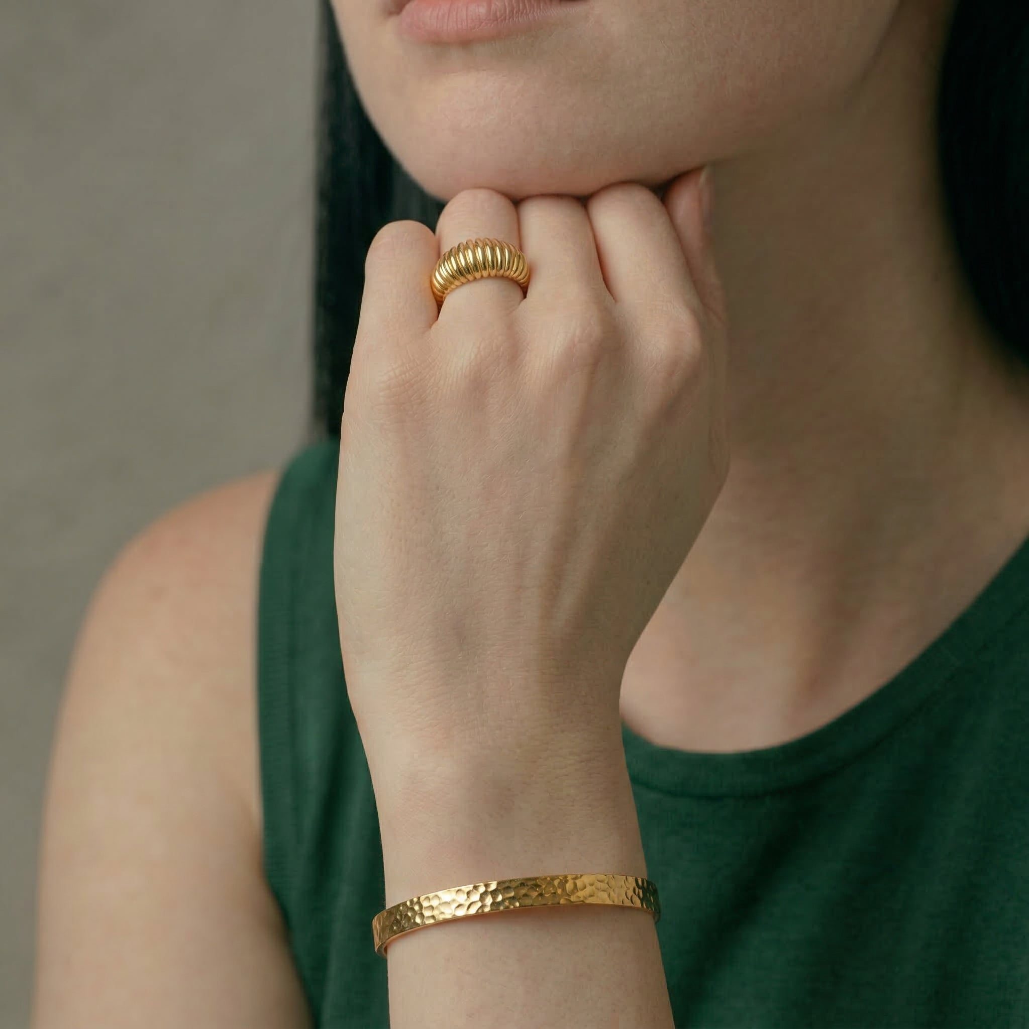 Gold-plated ring worn on hand with bracelet