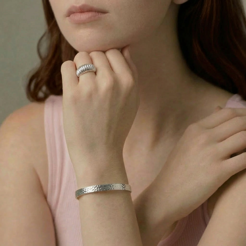 Silver ring and bracelet on model's hand