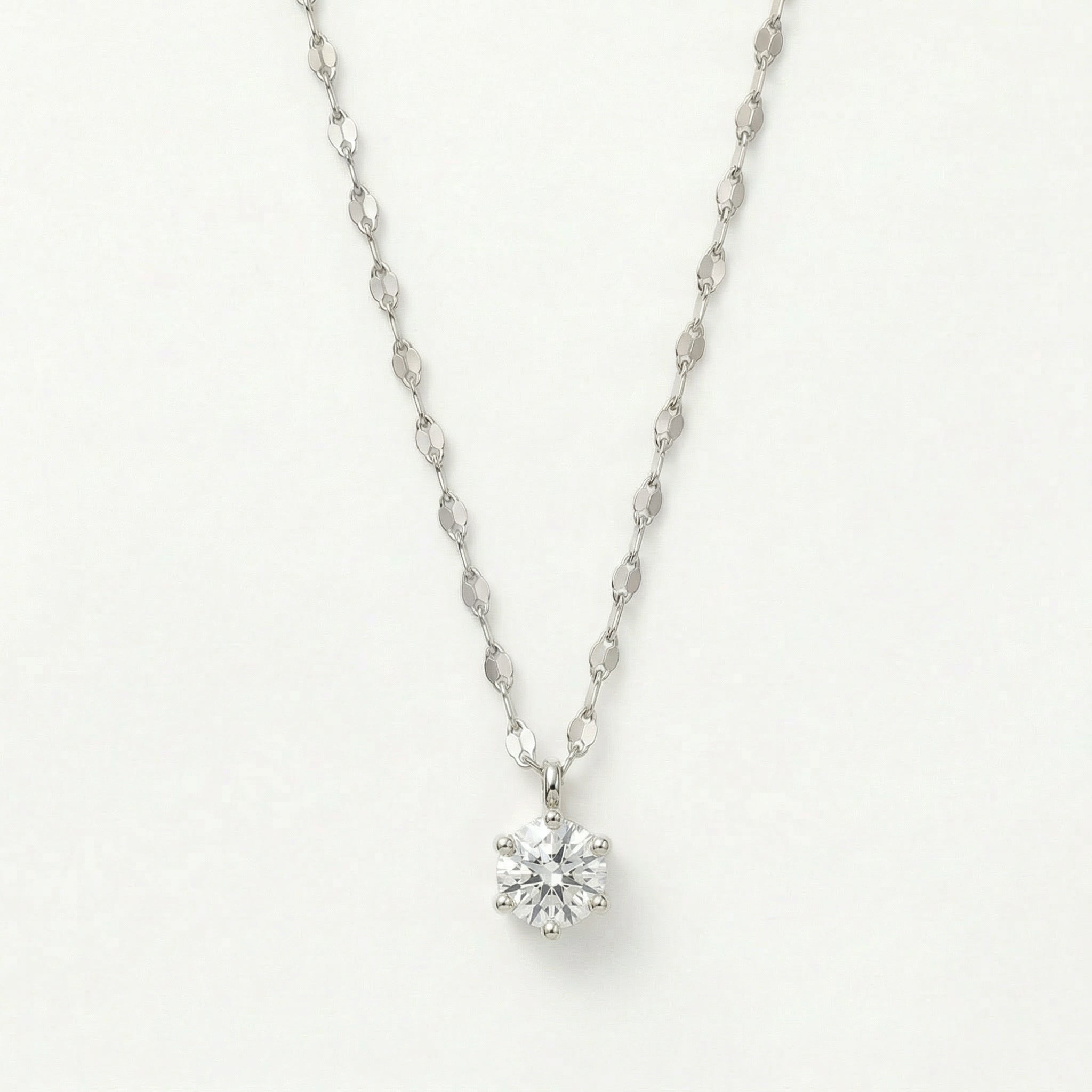 Silver solitaire crystal necklace on white background