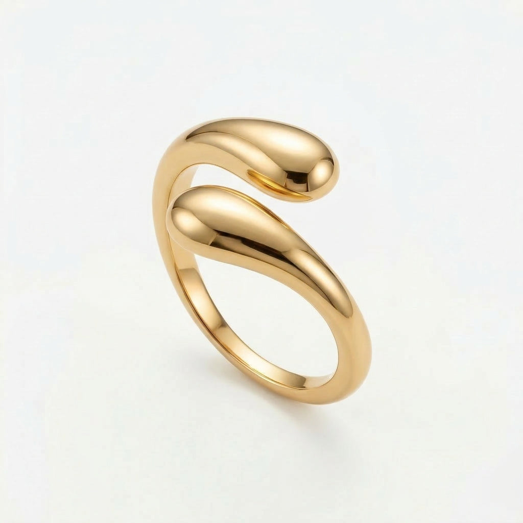 Gold-plated twist hug ring on white background