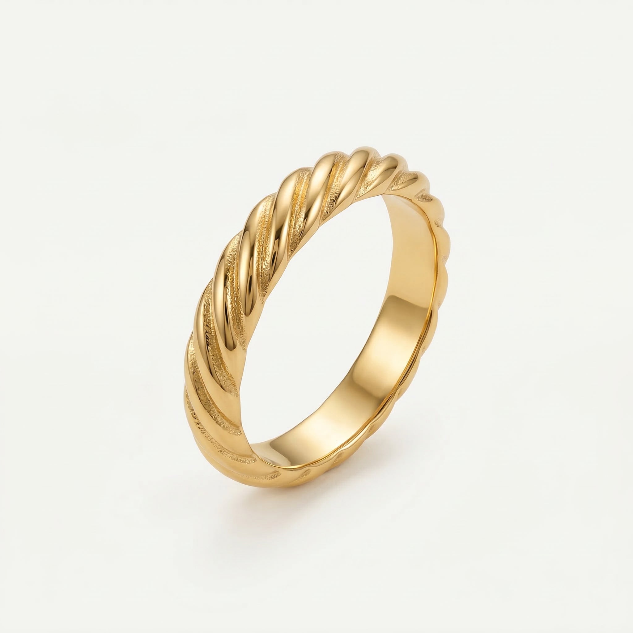 Gold-plated twisted ring at an angle